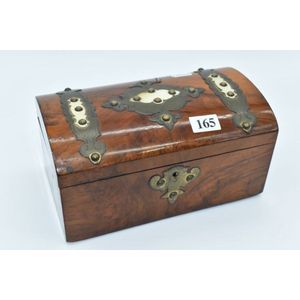 An antique dome top walnut tea caddy with metal and bone mounts
