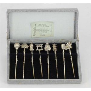 A set of Japanese silver cocktail Picks, with various finials.…