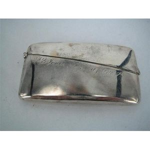 An Australian silver card case, rectangular, curved for the…