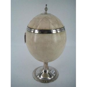 A silver-mounted ostrich egg cup and cover, with urn finial and…
