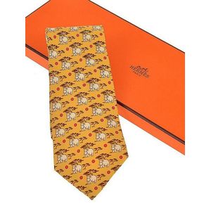 A silk tie by Hermes, styled with hippopotamuses and trees on a&hellip;