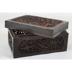 A carved tortoiseshell lidded box decorated with exotic birds…