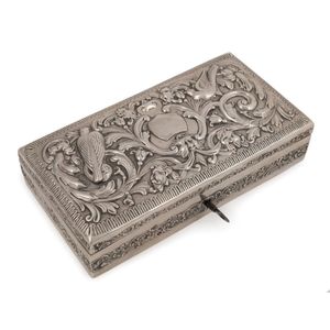 An antique sterling silver jewellery box with repousse…