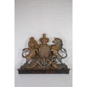A large and impressive carved and polychrome wood Royal Coat of…