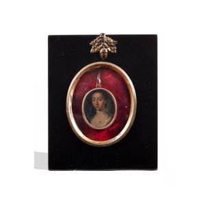 A Georgian enamel portrait miniature of a lady, in an oval gilt…