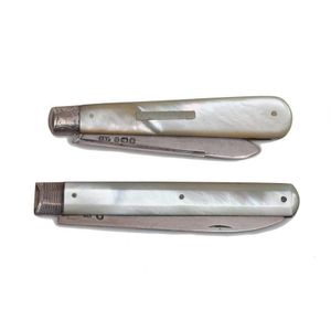 Two sterling silver pen knives with mother of pearl handles,…
