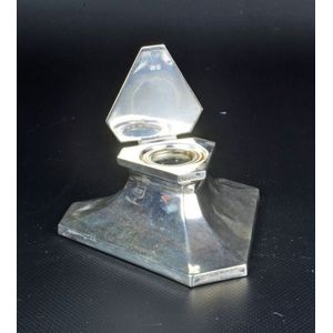 Weighted sterling silver ink well taking a triangular form. By…