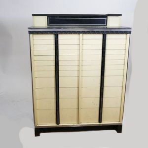 An American Art Deco metal and wood dentist's cabinet, cream…