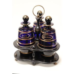 Bristol blue glass decanter set, c.1,800, on a papier mache and…