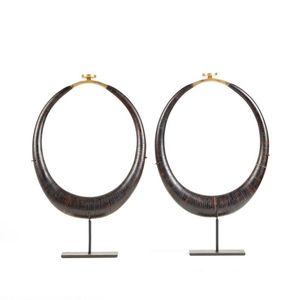 A pair of Kalabubu coconut necklaces, tapering shape, slices of…