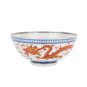 An iron-red decorated 'Dragon' bowl, Guangxu mark. The rounded…