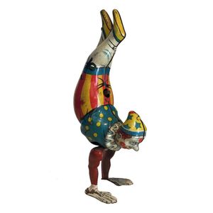 A collection of tin circus clowns by Kohler, Wells and Gama,…