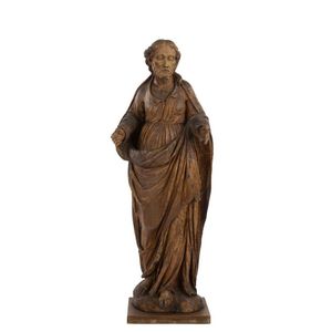 An apostle statue, carved wood with remains of polychrome…
