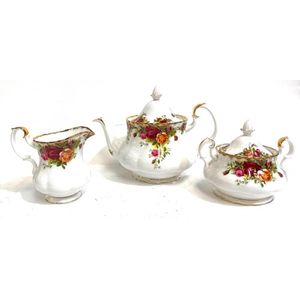 A Royal Albert country roses teapot, sugar bowl & creamer