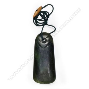 A pounamu toki pendant, pierced with hourglass suspension hole…