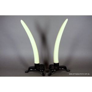 A pair of ivory tusks on stands, probably second quarter 20th…