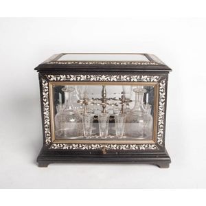 A bevel glazed marquetry ivory inlaid ebonized drinks cabinet,…