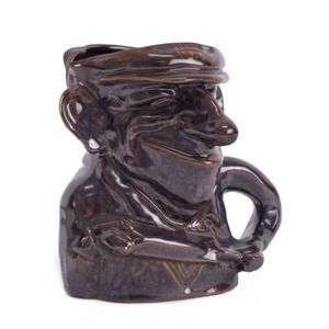 Don Bradman. Brown Bendigo Pottery brown glaze character toby…