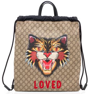 An 'Angry Cat' Drawstring backpack by Gucci, styled in monogram&hellip;