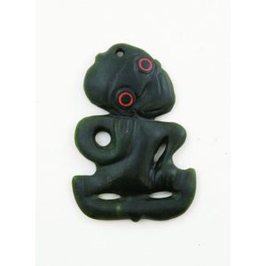 An 19th century or early 20th century greenstone hei tiki, red…