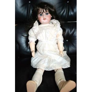 A Simon & Halbig porcelain headed sleeping eye doll, with…