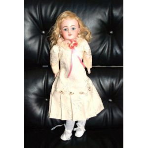 A Simon & Halbig porcelain headed doll, glass eyes, four teeth…