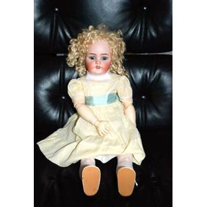 A Simon & Halbig porcelain headed sleeping eye doll, four teeth…