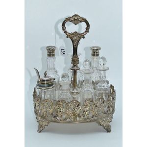 A stunning silver plate cruet set comprising of seven condiment…