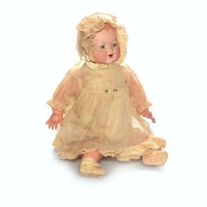 Early doll. Ceramic head. Celluloid limbs. Opening eyes. Needs…