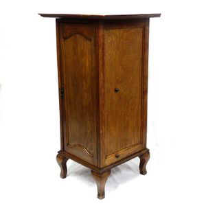 An early 1900s oak gramophone record cabinet, the interior with…