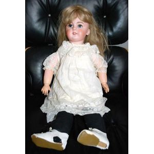 A DEP porcelain headed sleeping eye doll, four teeth upper,…