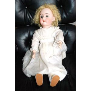 A DEP porcelain headed sleeping eye doll, four teeth upper,…