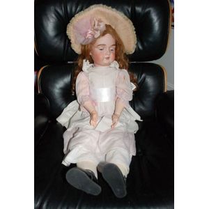 A porcelain headed sleeping eye doll, four teeth upper, with…
