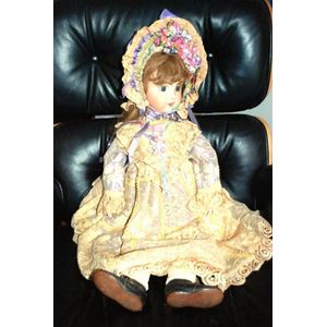 A porcelain headed doll, glass eyes, six teeth upper, with…