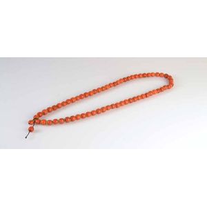 A Chinese strand of carved coral beads with gilt metal spacers.&hellip;