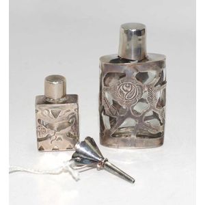 Two various silver cased scent bottles each glass bottle, with&hellip;