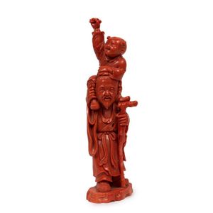 A carved coral figural group, 20th century, of an old man&hellip;