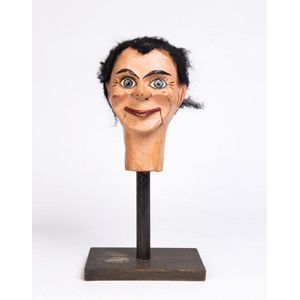 A ventriloquist puppet head on stand, early 20th century. Head…
