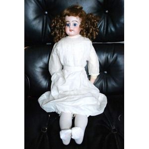 A porcelain headed sleeping eye doll, four teeth upper, with…