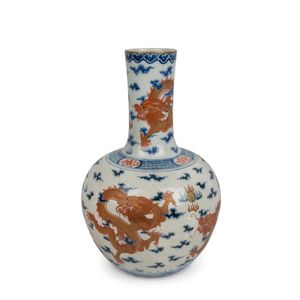 An antique Chinese porcelain vase decorated with five iron red…