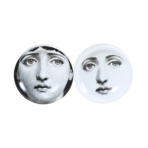 Piero Fornasetti two ashtrays, printed faces in black and white.…