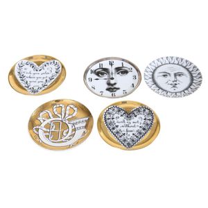 Piero Fornasetti five plates, Varying printed images on all…