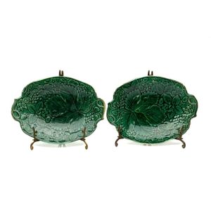 A pair of majolica green strawberry leaf dishes on brass stands,&hellip;