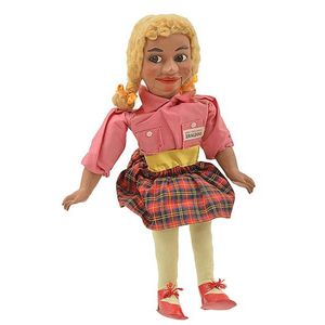 Geraldine Gee doll, pink shirt, tartan skirt, yellow tights…