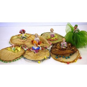 Seven good vintage half doll milk jug covers together with a…
