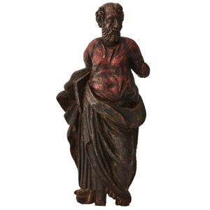 A carved polychrome relief sculpture of a bearded male Saint,…