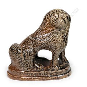 Unmarked Hobsonville Pottery salt glaze dog doorstop, seated…