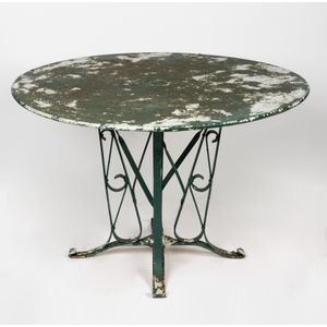A French metal garden table, early 20th century, on a bracket…