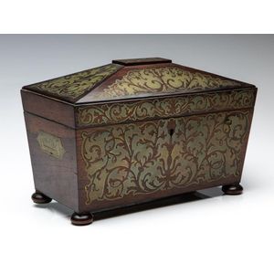 A mahogany veneer tea caddy with heavily inlaid brass detailing…