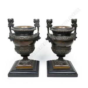 A pair of 19th century French fancy bronze urns, the raised…